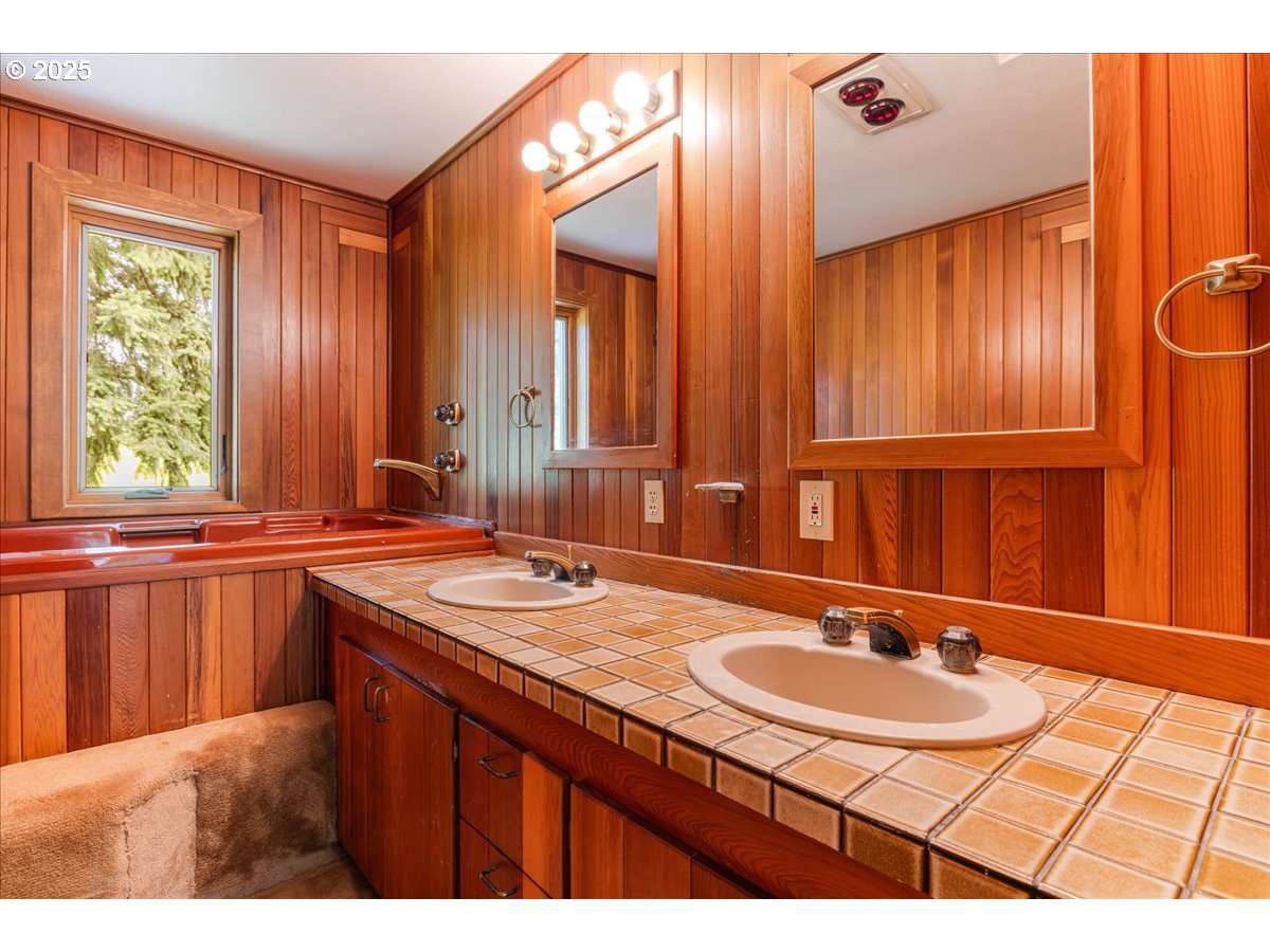 18258 South Dillman Road Oregon City, OR 97045 - Photo 25 of 43 a bathroom with a sink and a mirror