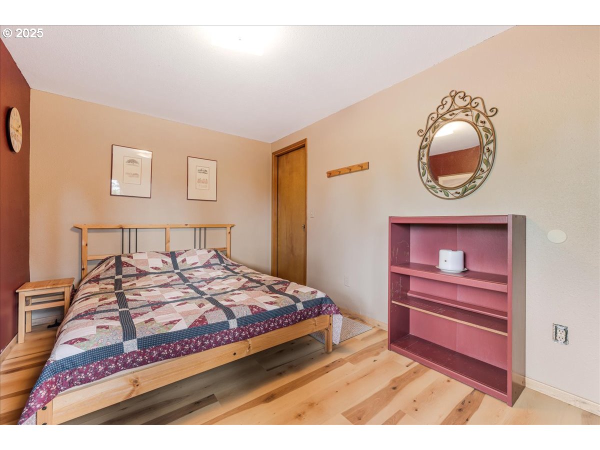 18258 South Dillman Road Oregon City, OR 97045 - Photo 29 of 43 a bedroom with a bed and a mirror