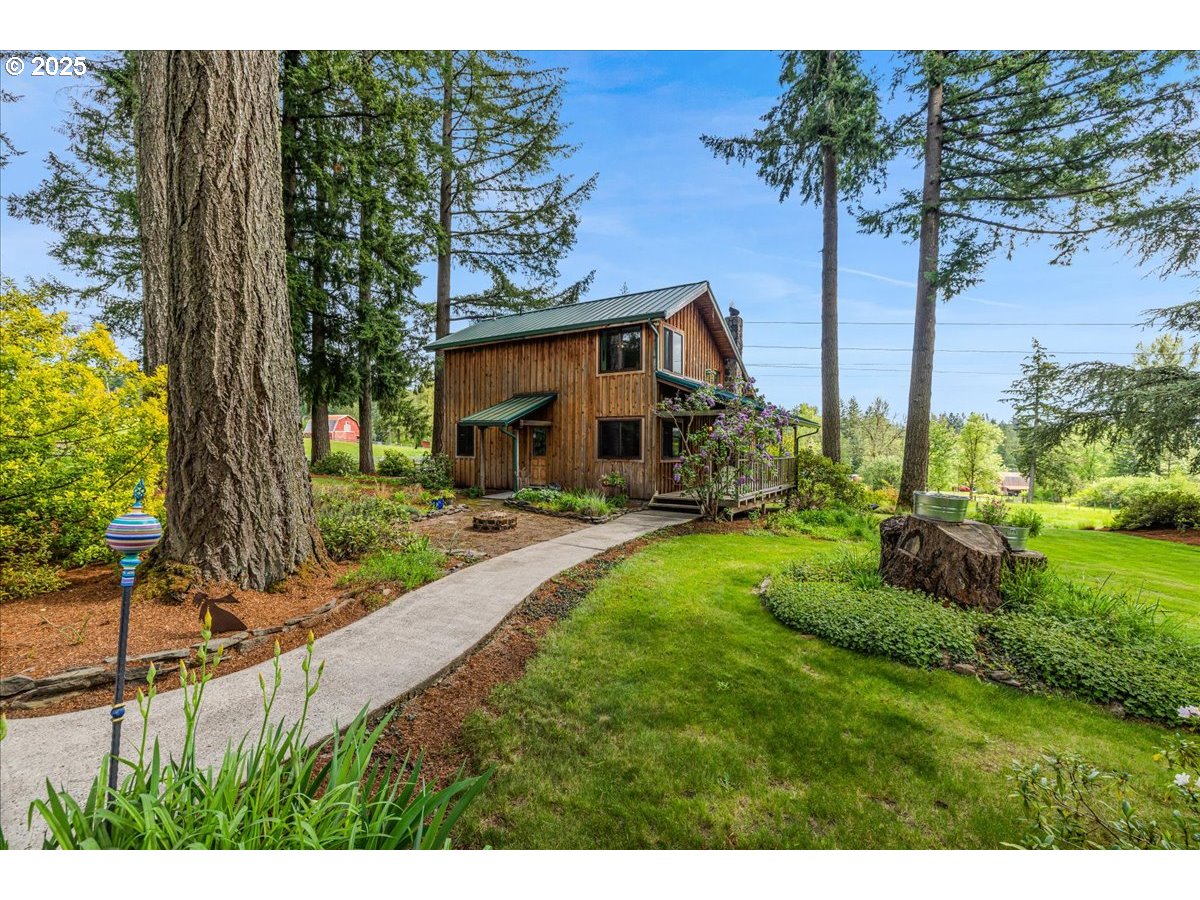 18258 South Dillman Road Oregon City, OR 97045 - Photo 3 of 43 a front view of a house with garden