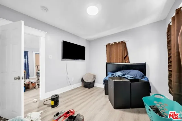 a view of room with toys and wooden floor