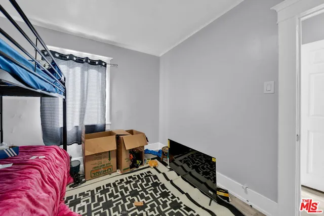 a front view of a house with glass windows and garage