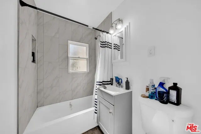 a view of a white house with a outdoor space