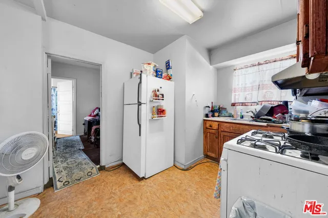 a bathroom with a toilet and a shower curtain