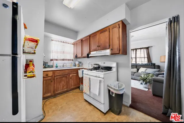 a room with furniture a rug and a window