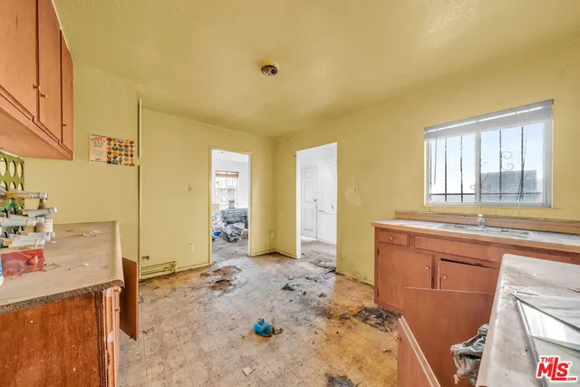 an aerial view of a houses with yard