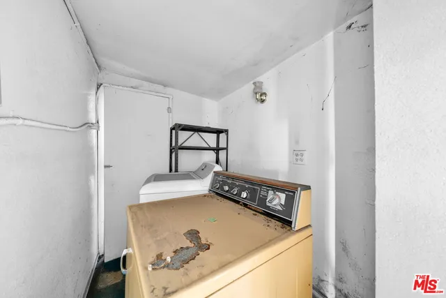 an aerial view of residential houses with city view