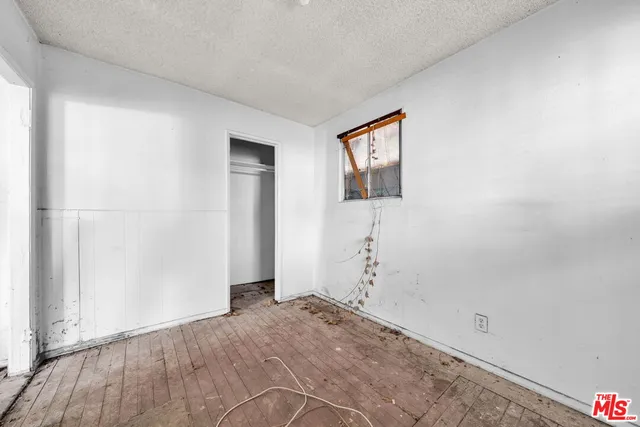 a view of room with furniture and windows