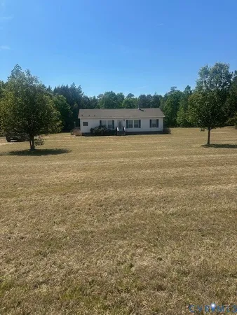 a view of a lake with a yard