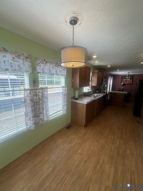 16738 Loco School Road Yale, VA 23897 - Photo 13 of 33 a kitchen with stainless steel appliances granite countertop a stove and a wooden floors