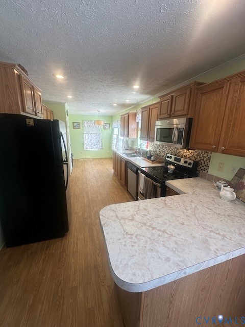 16738 Loco School Road Yale, VA 23897 - Photo 17 of 33 a living room with stainless steel appliances furniture a fireplace and a kitchen view