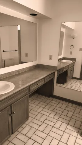a kitchen with a sink and a refrigerator