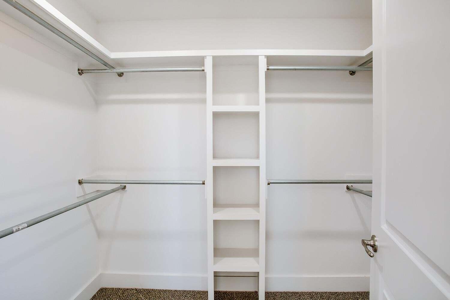 811 North 4th Street Wolfforth, TX 79382 - Photo 12 of 18 a view of walk in closet with empty racks
