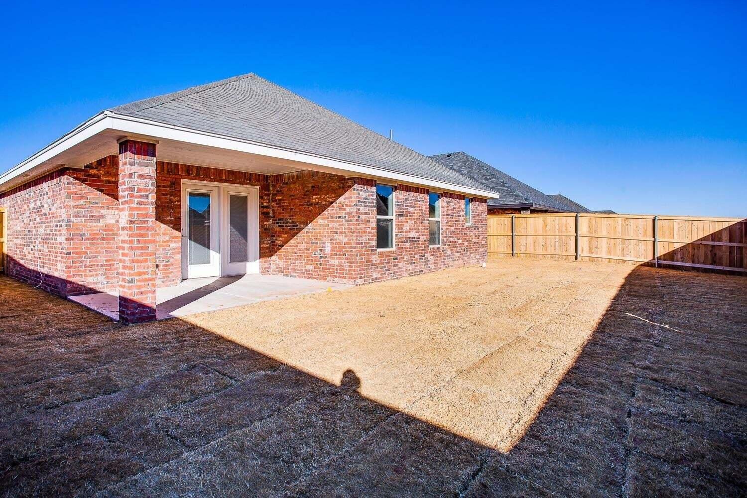 811 North 4th Street Wolfforth, TX 79382 - Photo 18 of 18 a view of backyard with a garden and deck