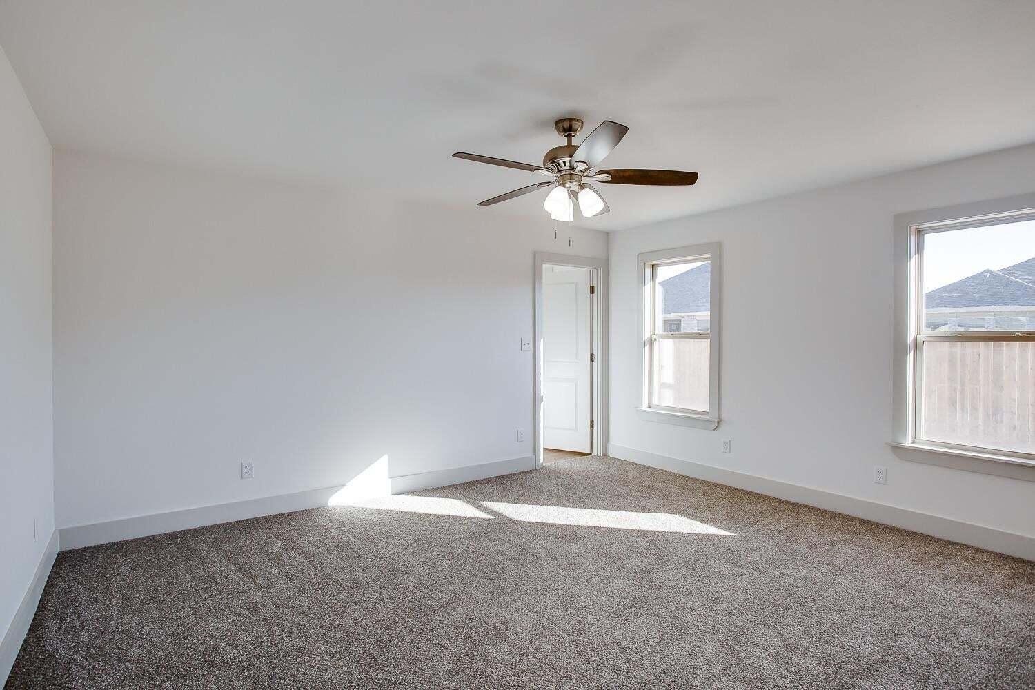 811 North 4th Street Wolfforth, TX 79382 - Photo 10 of 18 a view of an empty room with a window