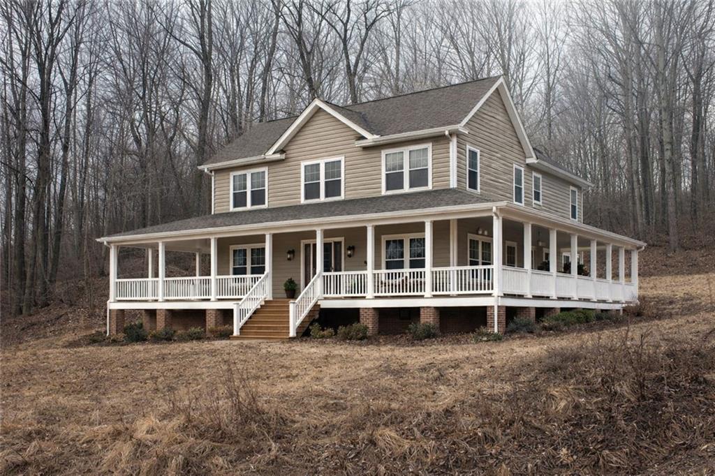 Lot 6 Ten School Road Blairsville, PA 15717 - Photo 4 of 7 a view of a house with a yard and large trees
