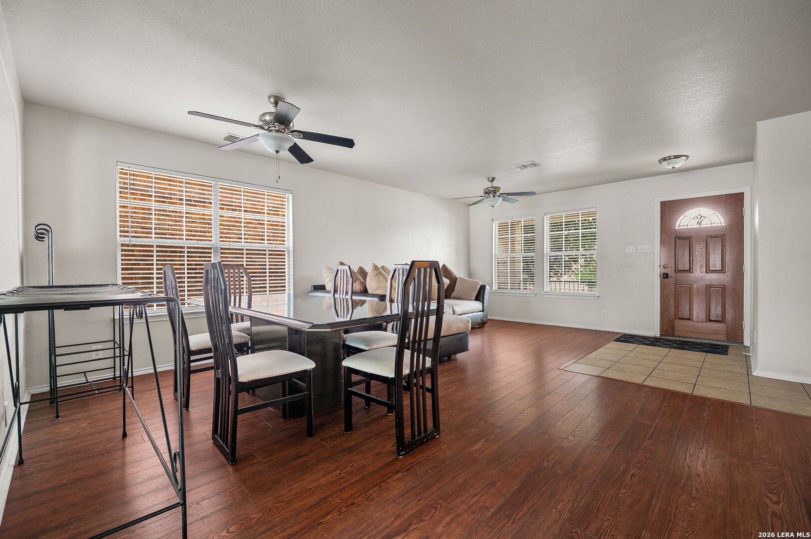 7207 Avery Road Live Oak, TX 78233 - Photo 9 of 32 a view of a dining room with furniture window and wooden floor