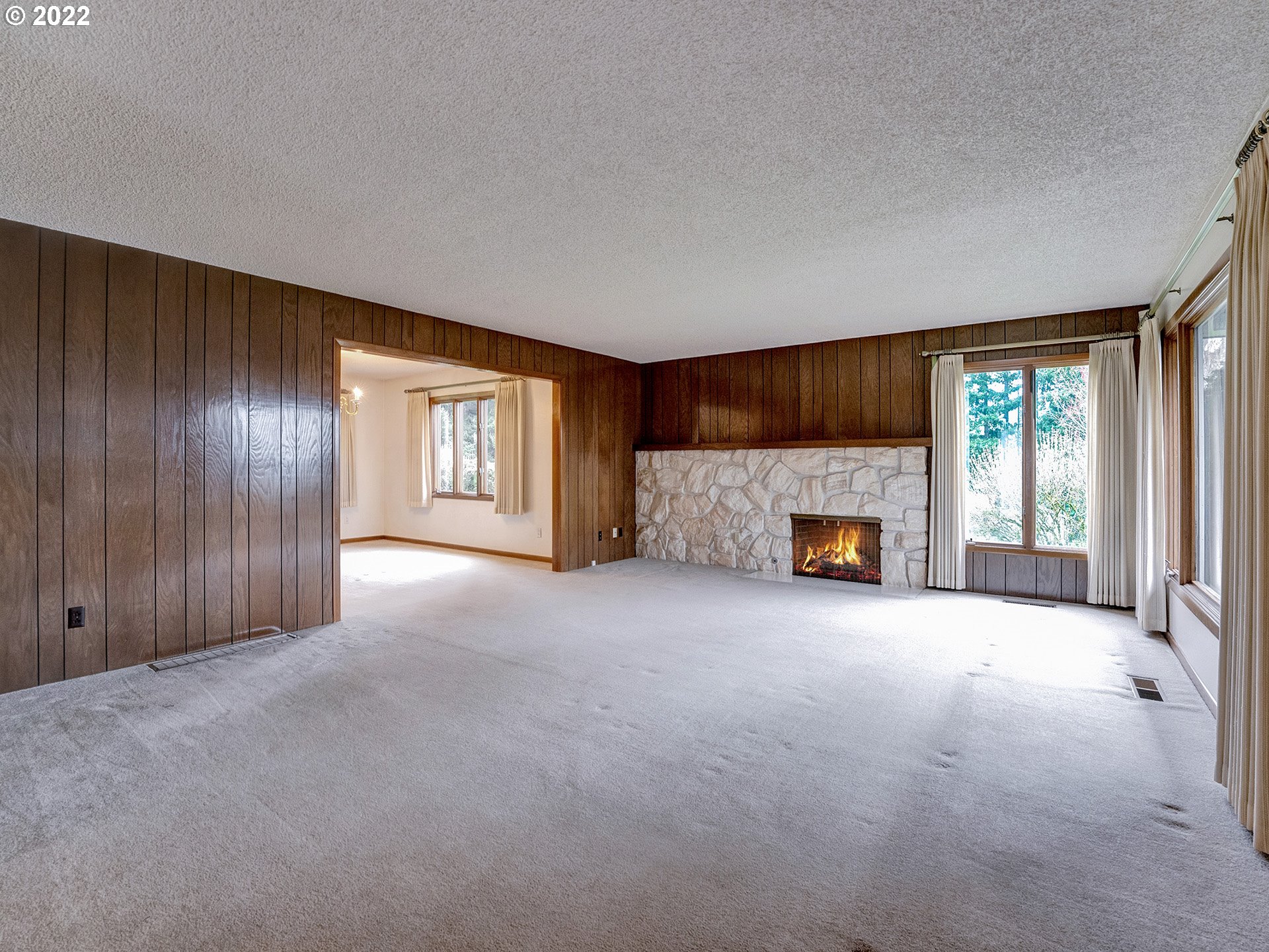 27651 Southeast Kelso Road Boring, OR 97009 - Photo 14 of 32 a view of an empty room with a fireplace and a window
