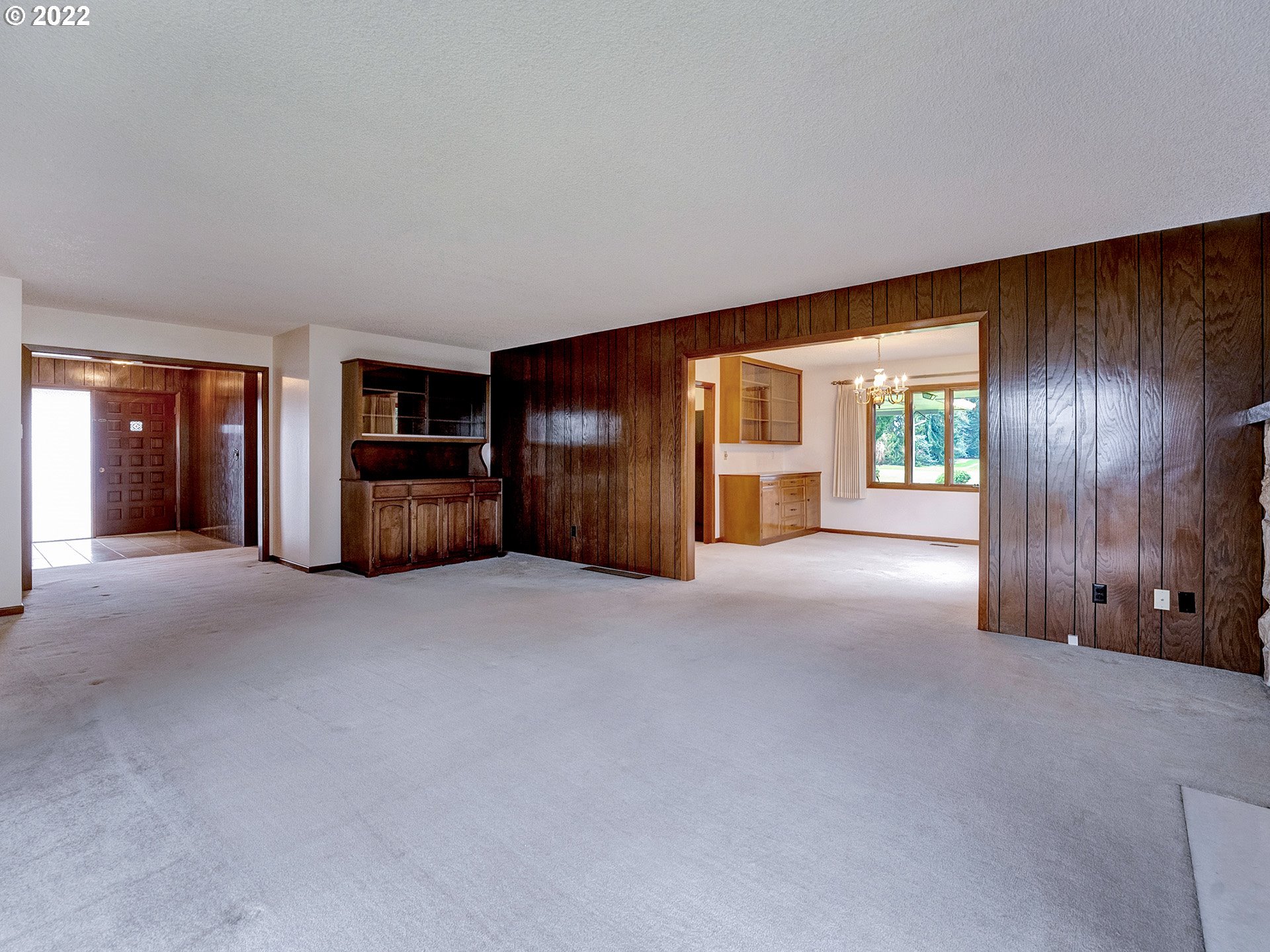27651 Southeast Kelso Road Boring, OR 97009 - Photo 15 of 32 a view of an empty room with a fireplace and cabinet