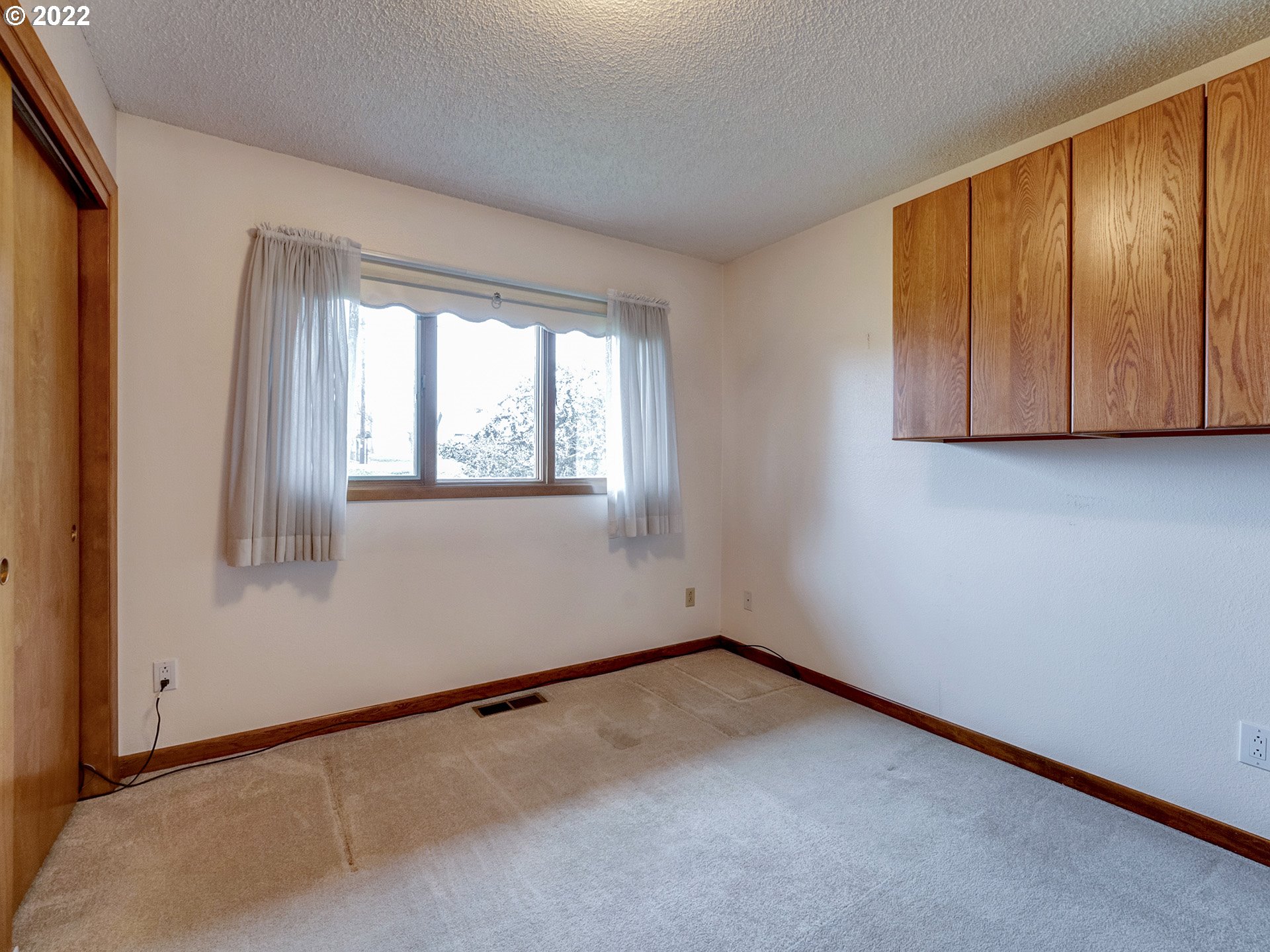 27651 Southeast Kelso Road Boring, OR 97009 - Photo 24 of 32 an empty room with wooden floor and windows