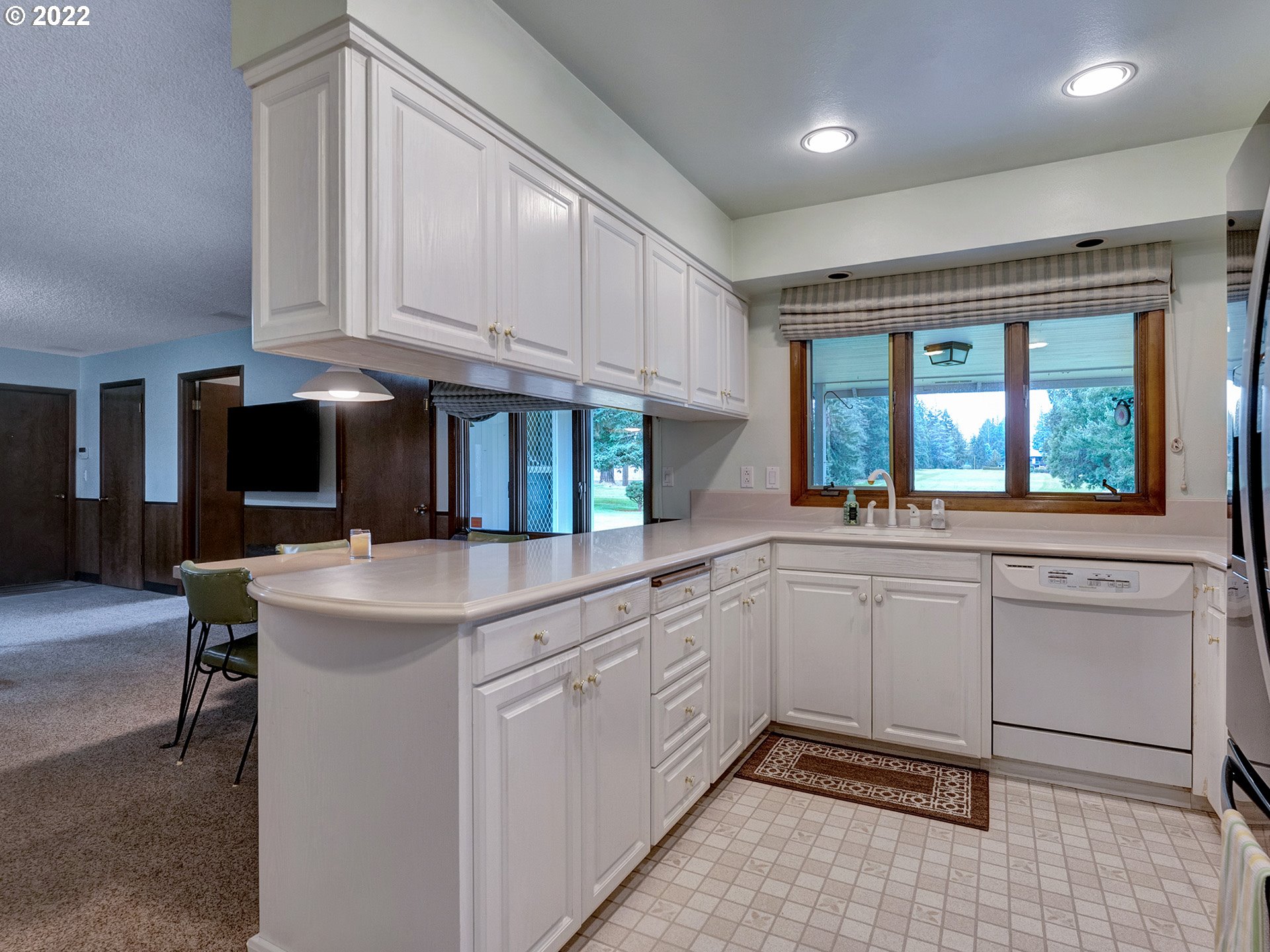 27651 Southeast Kelso Road Boring, OR 97009 - Photo 4 of 32 a kitchen that has a sink and a stove in it