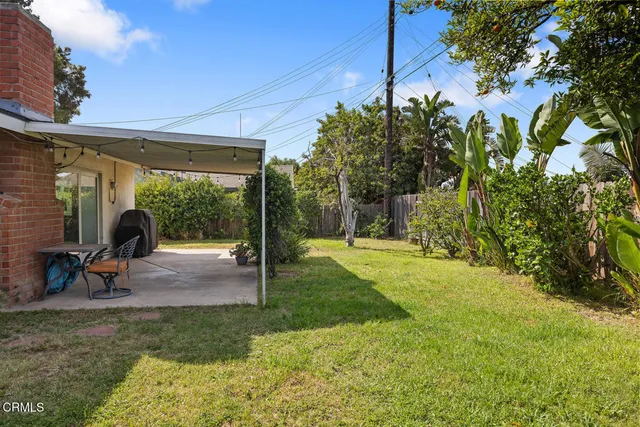 a view of a backyard with a patio