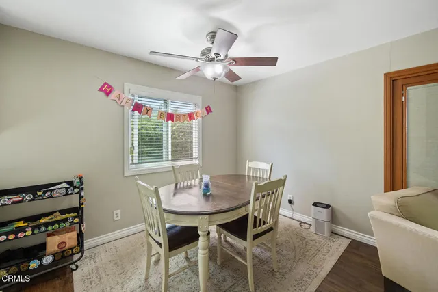 a dining room with furniture and window