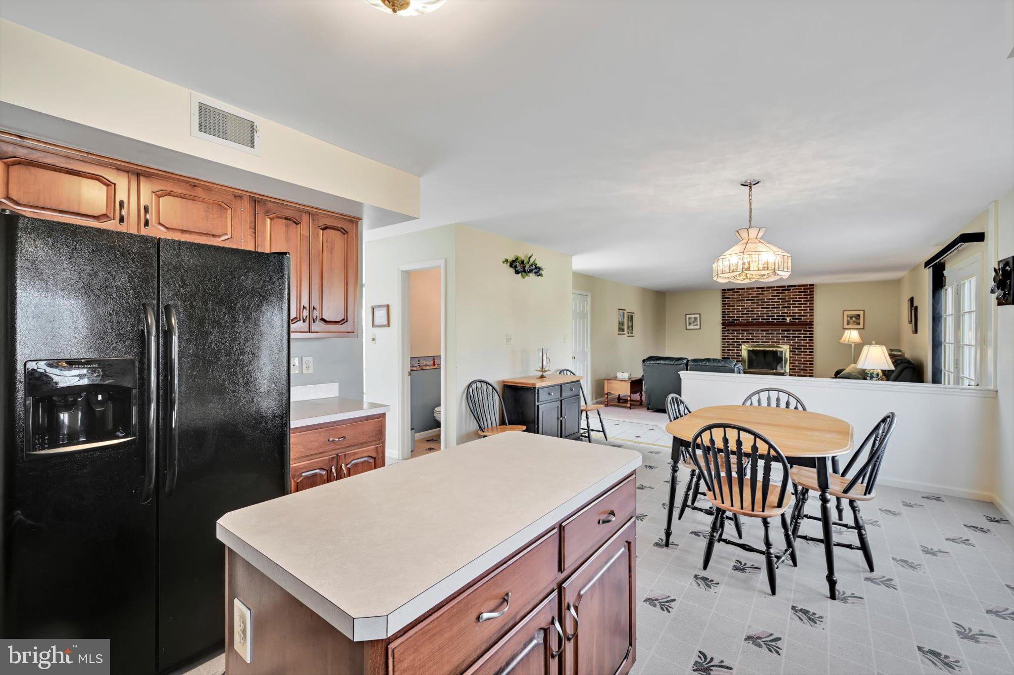 2701 Huyett Drive Sinking Spring, PA 19608 - Photo 16 of 35 a large kitchen with a table chairs refrigerator and cabinets
