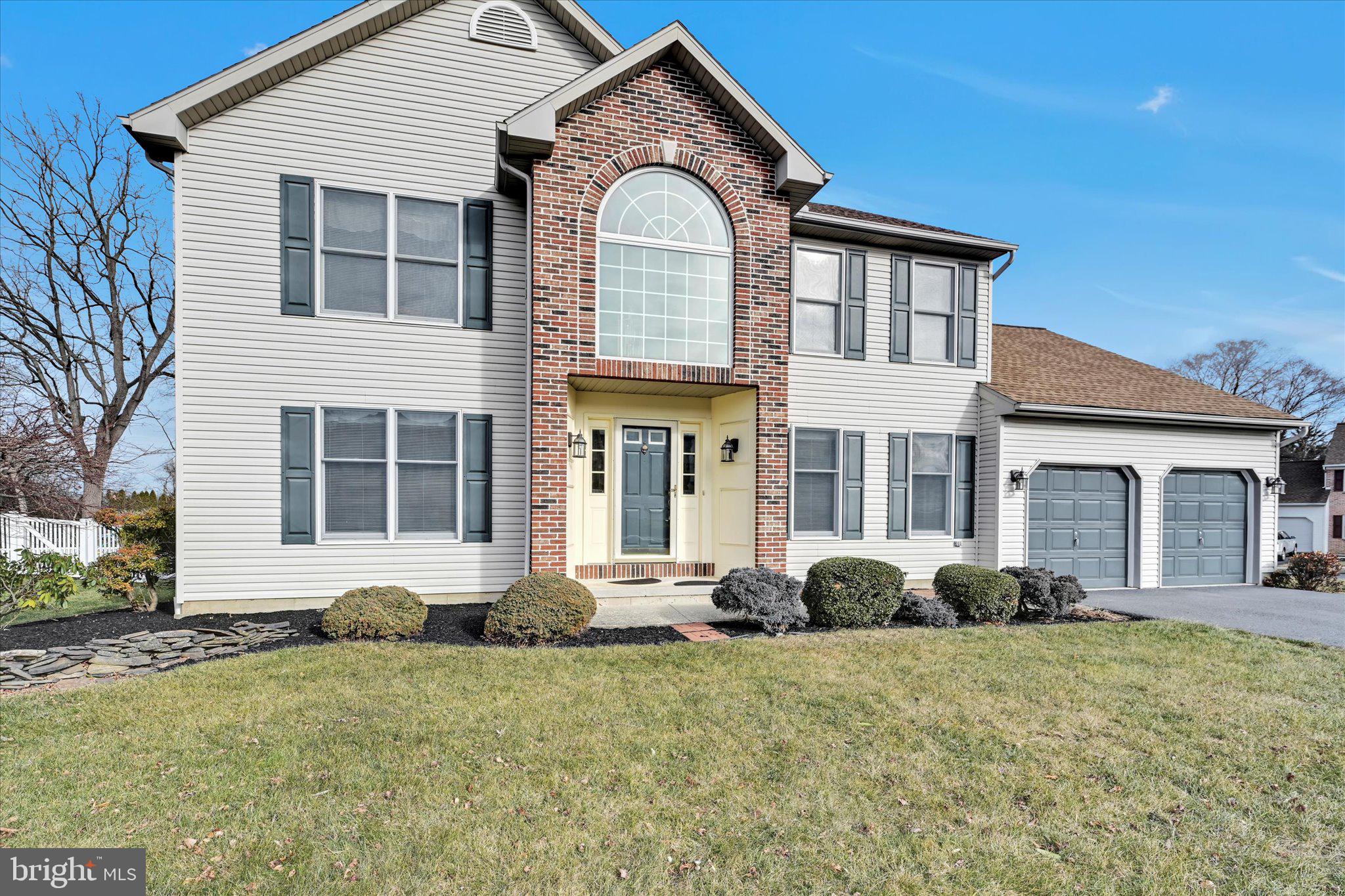 2701 Huyett Drive Sinking Spring, PA 19608 - Photo 2 of 35 a front view of a house with garden