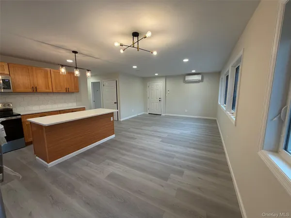 a view of kitchen with cabinets and wooden floor