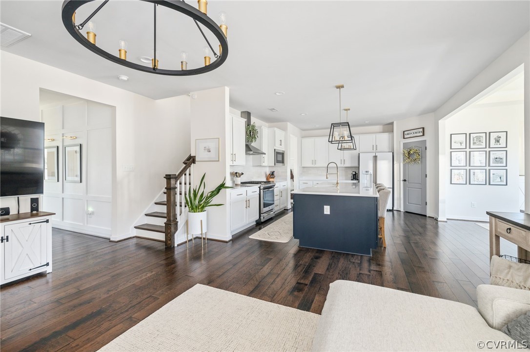 10946 Pointer Holly Path Glen Allen, VA 23059 - Photo 12 of 48 a living room with furniture a dining table wooden floor and a large window