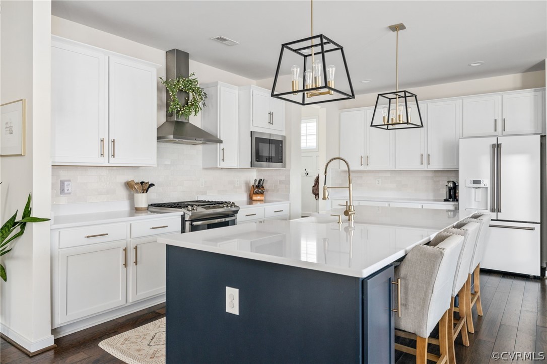 10946 Pointer Holly Path Glen Allen, VA 23059 - Photo 13 of 48 a kitchen with stainless steel appliances a sink stove and refrigerator