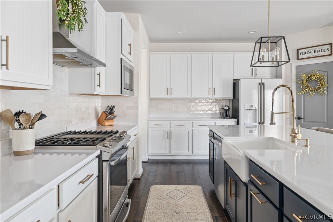 10946 Pointer Holly Path Glen Allen, VA 23059 - Photo 14 of 48 a kitchen with stainless steel appliances a sink stove and cabinets