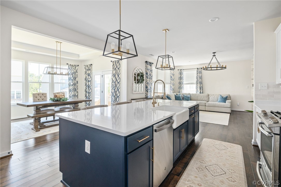 10946 Pointer Holly Path Glen Allen, VA 23059 - Photo 16 of 48 a kitchen with counter top space sink stove and wooden floor