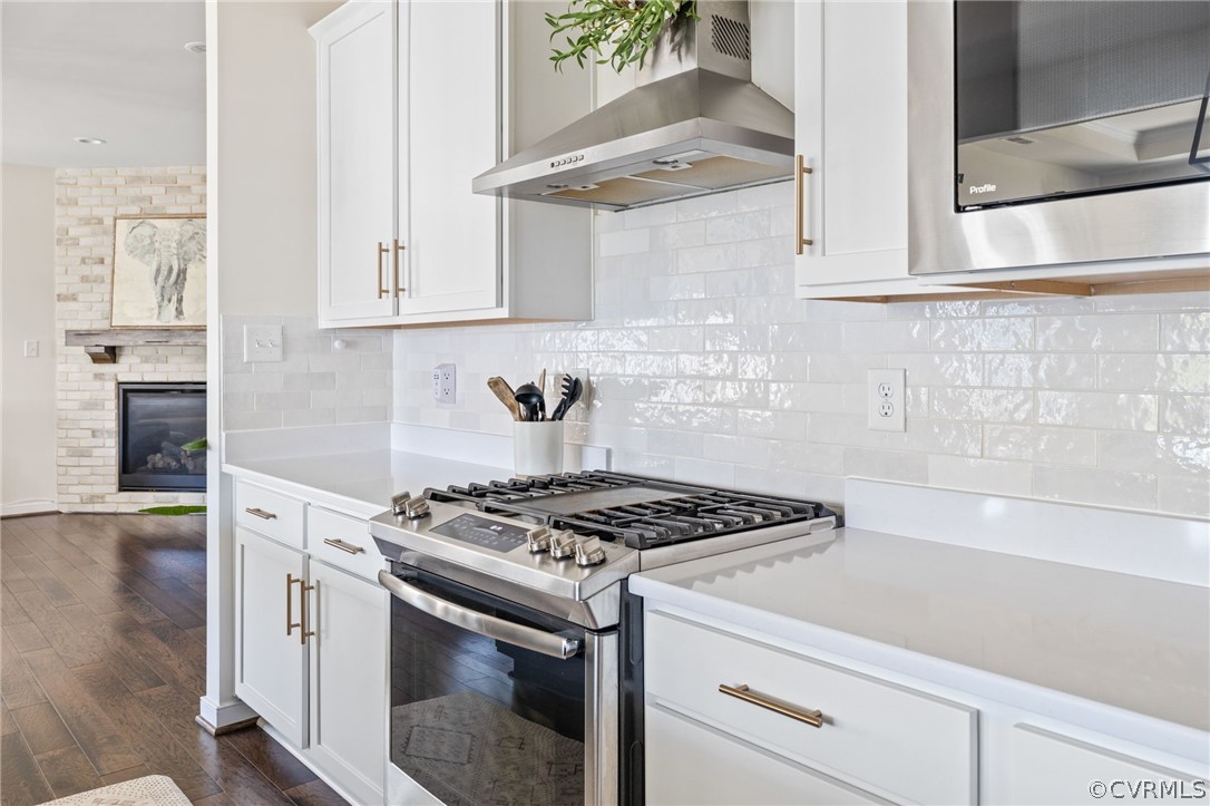 10946 Pointer Holly Path Glen Allen, VA 23059 - Photo 22 of 48 a kitchen with stainless steel appliances granite countertop white cabinets and a stove