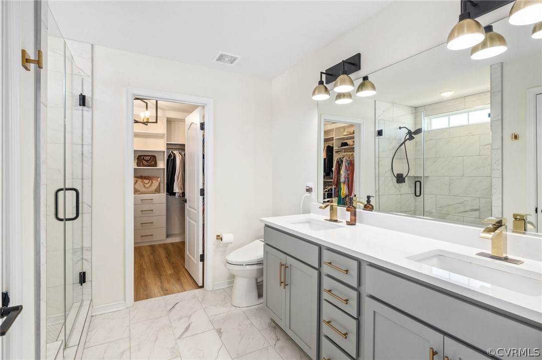 10946 Pointer Holly Path Glen Allen, VA 23059 - Photo 26 of 48 a bathroom with a double vanity sink mirror double and shower