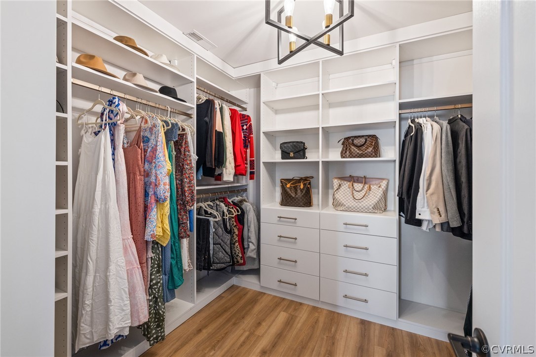 10946 Pointer Holly Path Glen Allen, VA 23059 - Photo 28 of 48 a view of walk in closet with clothes and shoes