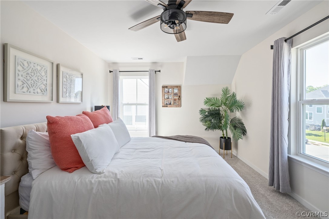 10946 Pointer Holly Path Glen Allen, VA 23059 - Photo 32 of 48 a bed sitting in a bedroom next to a window