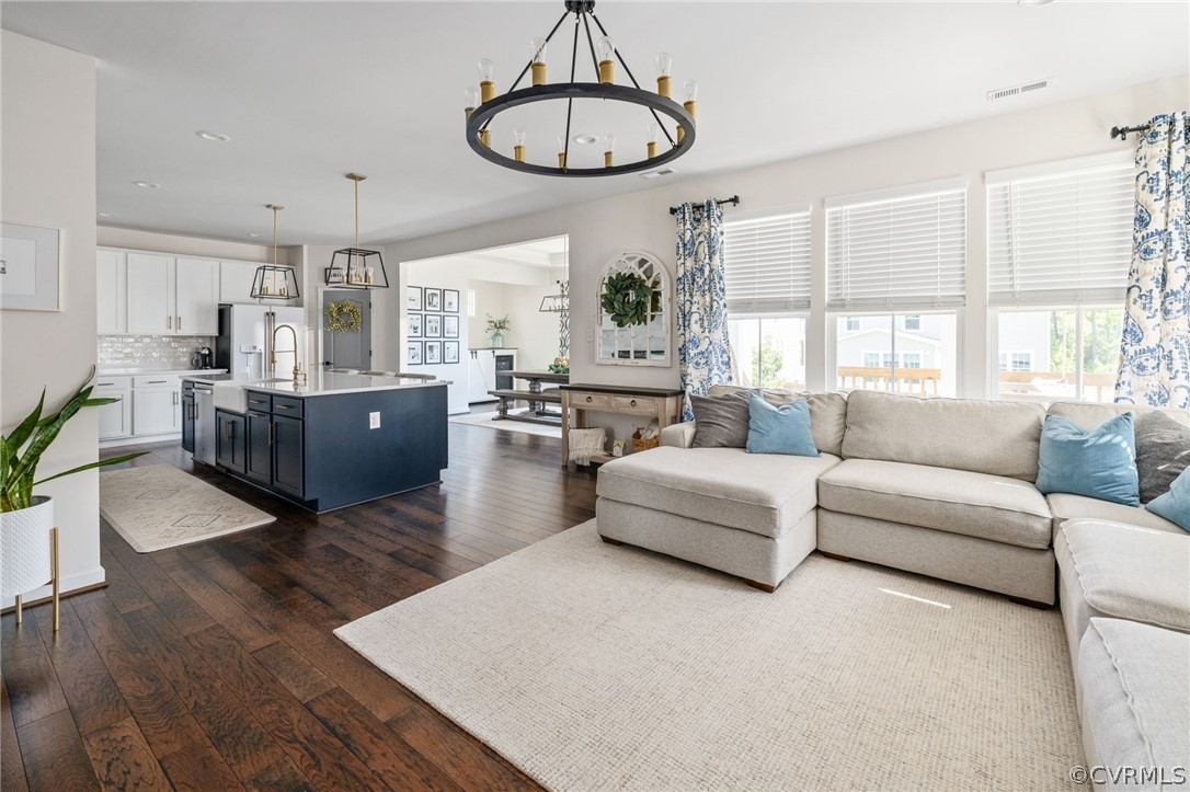 10946 Pointer Holly Path Glen Allen, VA 23059 - Photo 9 of 48 a living room with furniture or kitchen and a wooden floor