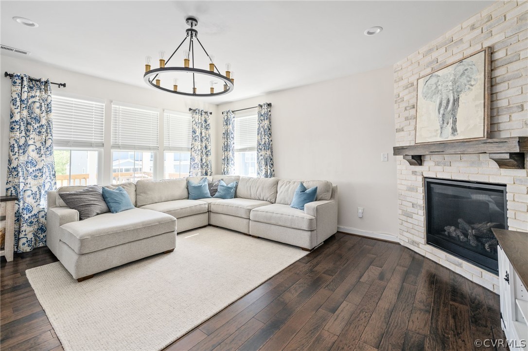 10946 Pointer Holly Path Glen Allen, VA 23059 - Photo 10 of 48 a living room with furniture a fireplace and a large window