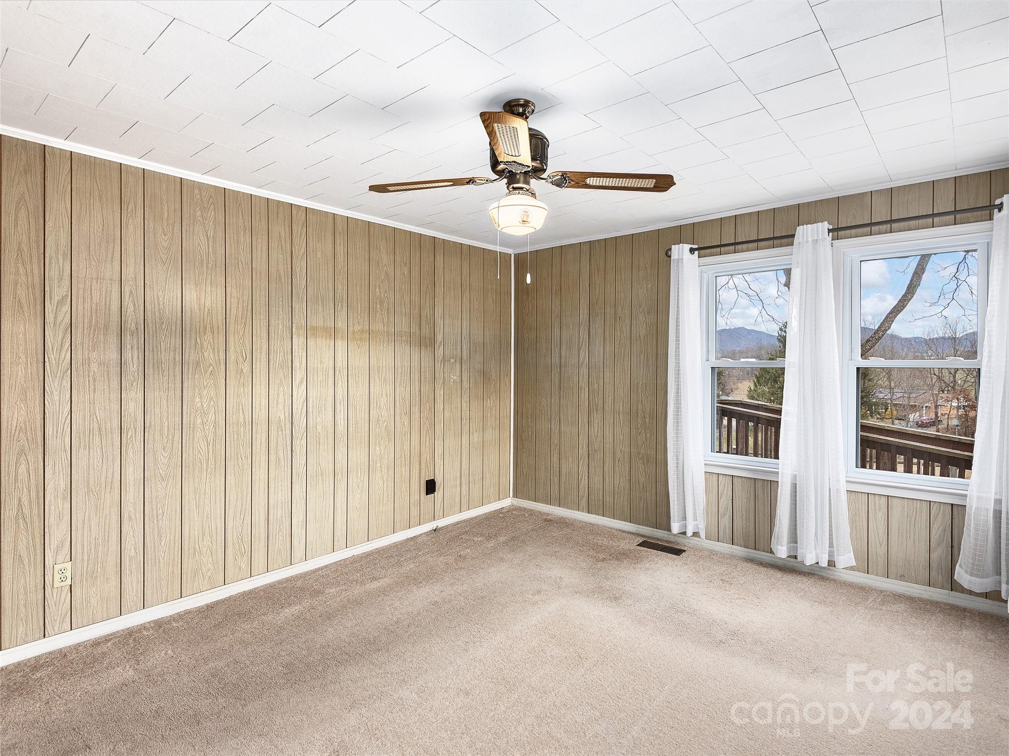 704 Mulberry Street Clyde, NC 28721 - Photo 11 of 36 a view of an empty room with a window