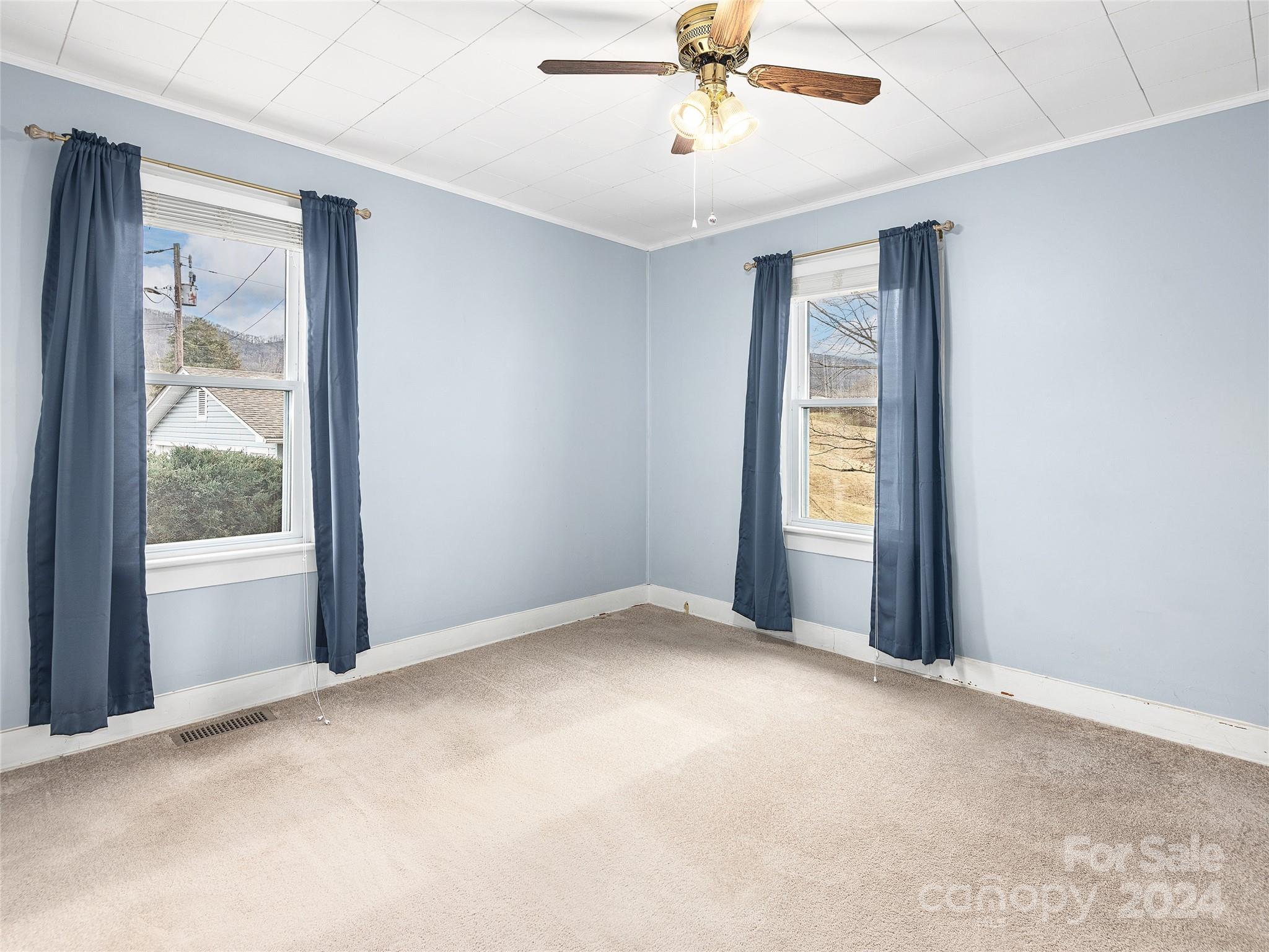 704 Mulberry Street Clyde, NC 28721 - Photo 14 of 36 an empty room with a window