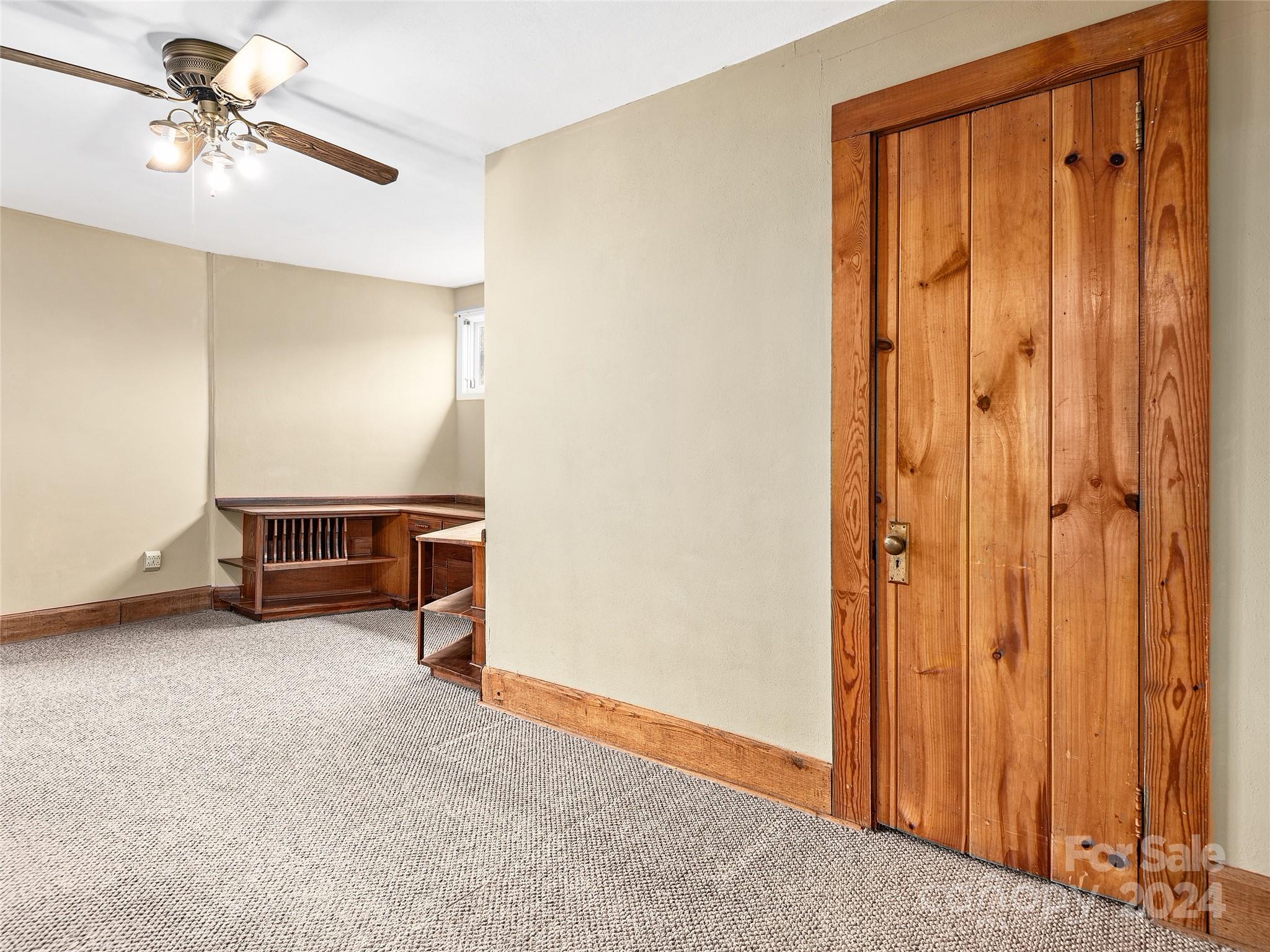 704 Mulberry Street Clyde, NC 28721 - Photo 16 of 36 a view of empty room with ceiling fan