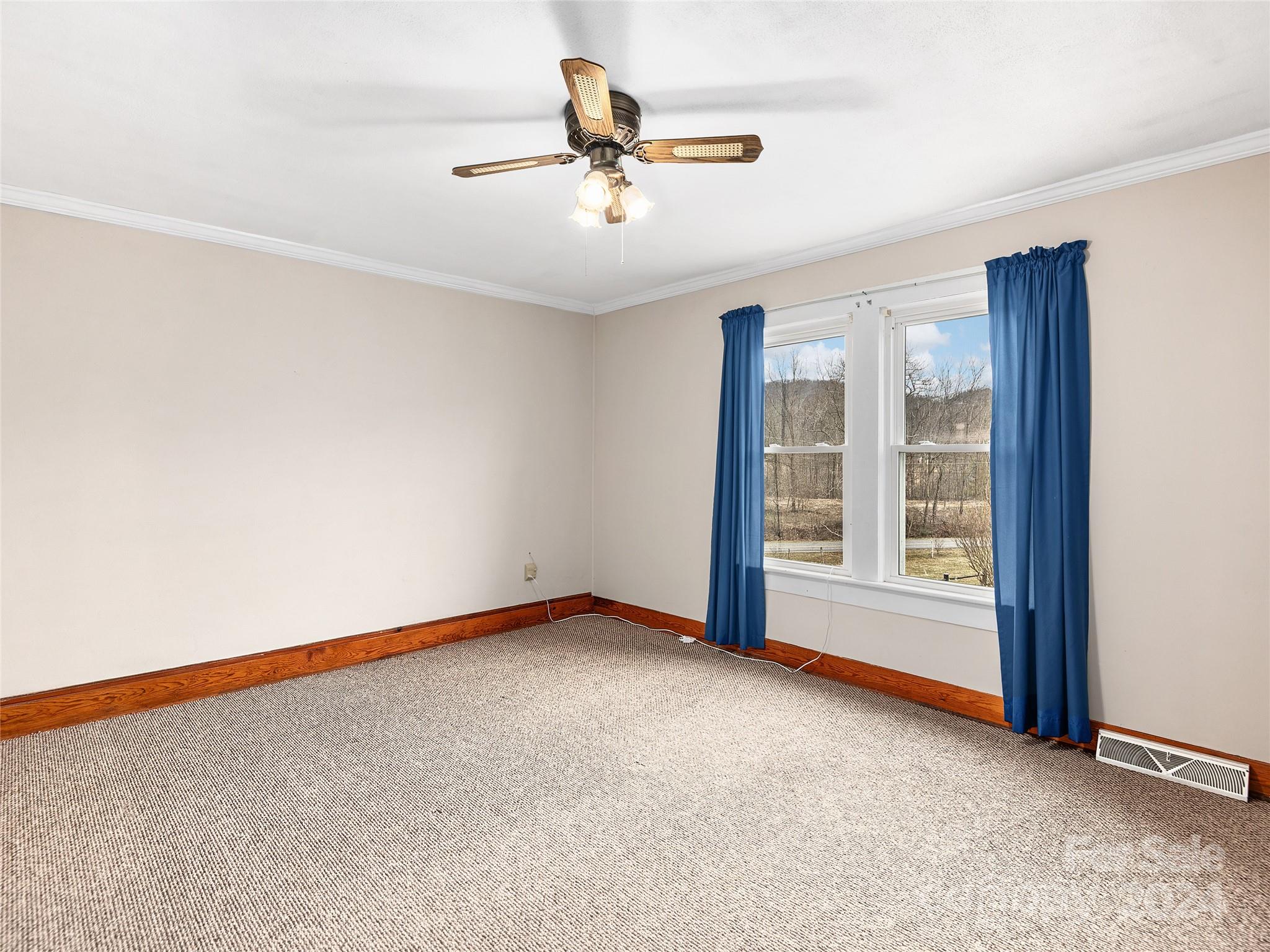 704 Mulberry Street Clyde, NC 28721 - Photo 19 of 36 a view of an empty room with a window