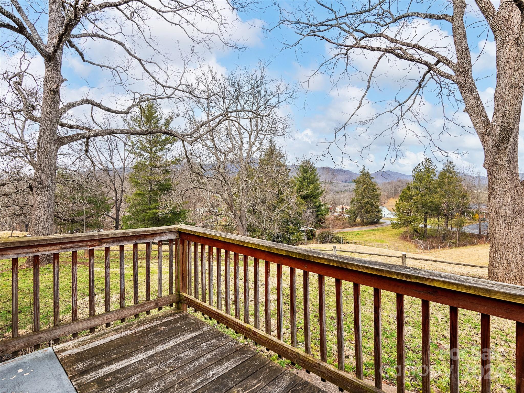 704 Mulberry Street Clyde, NC 28721 - Photo 21 of 36 a view of a wooden roof deck