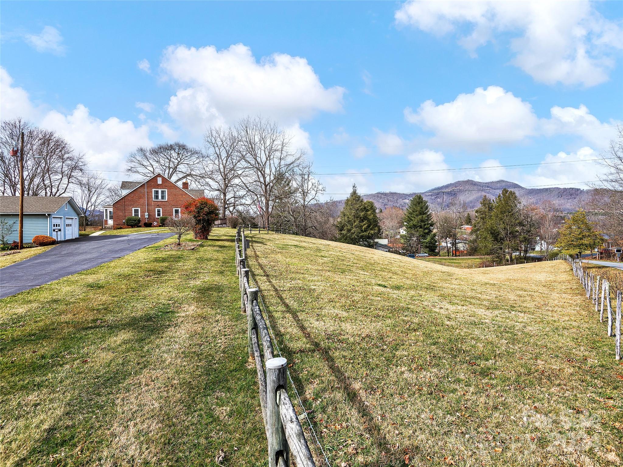 704 Mulberry Street Clyde, NC 28721 - Photo 29 of 36 a view of yard with swimming pool and green space