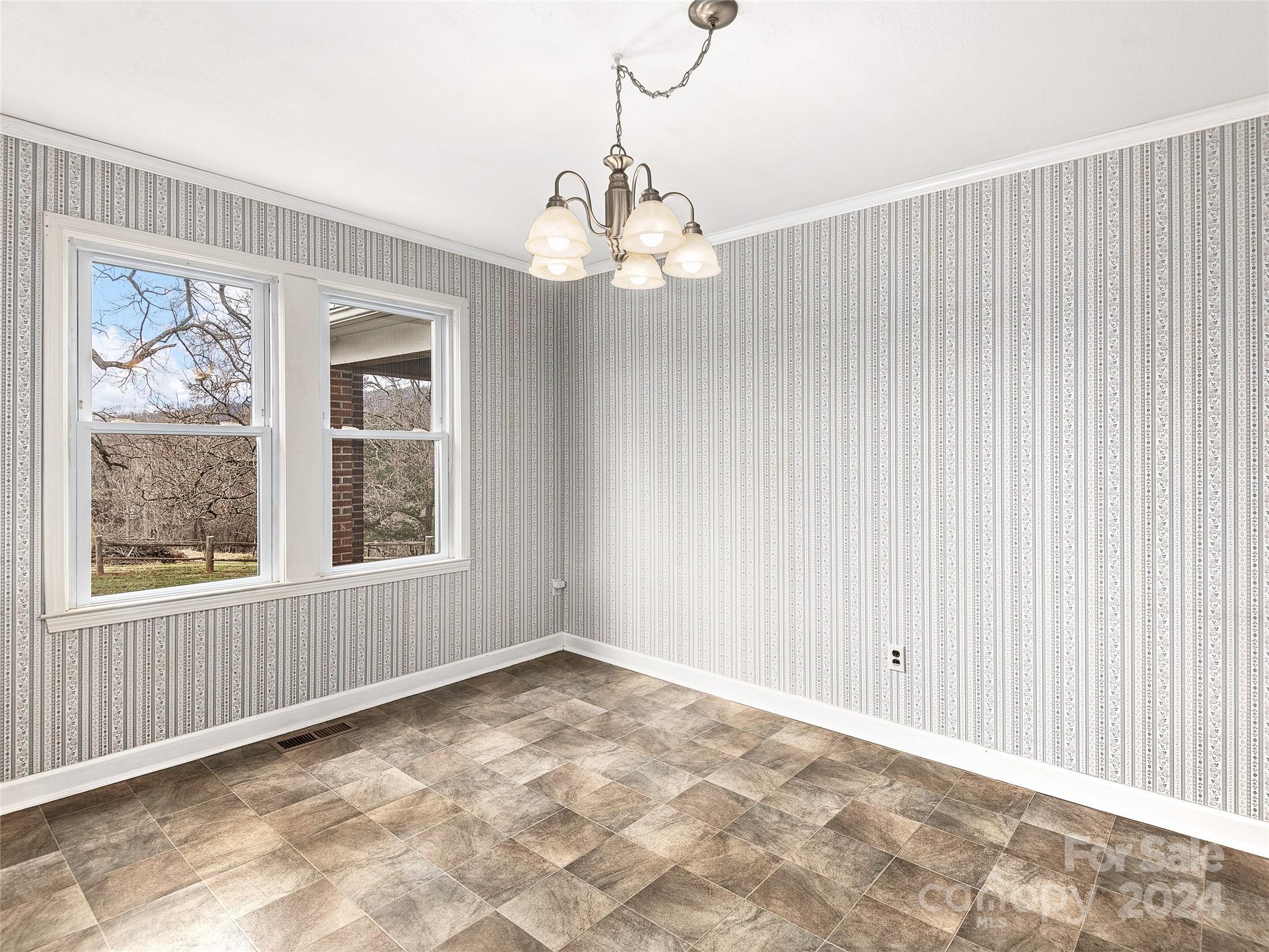 704 Mulberry Street Clyde, NC 28721 - Photo 8 of 36 a view of an empty room with a window