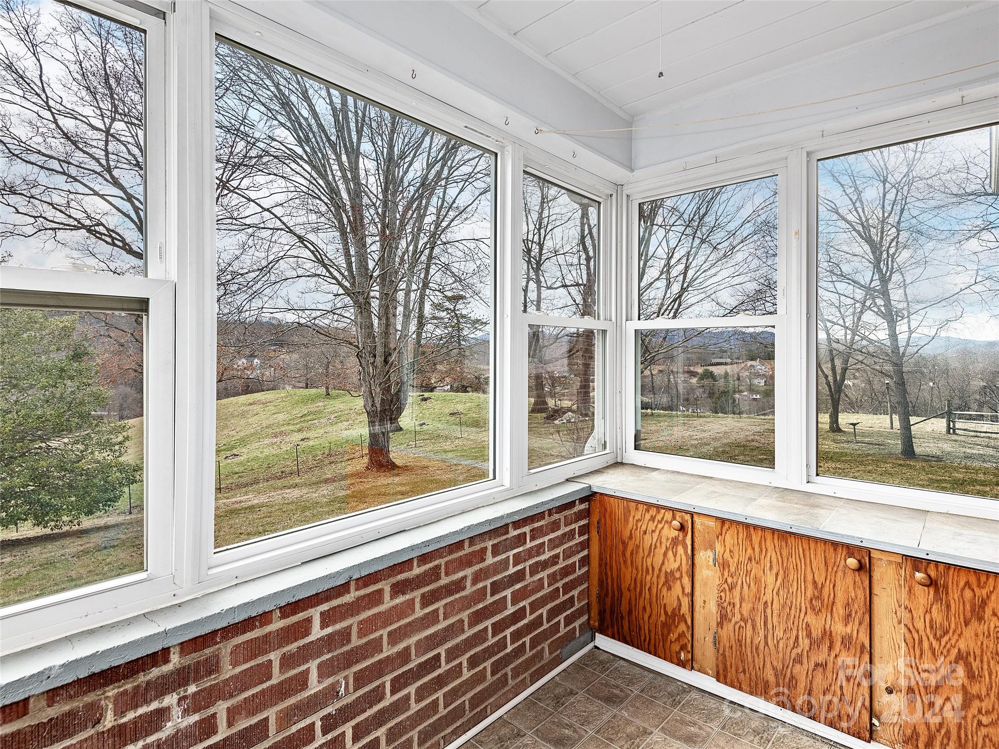 704 Mulberry Street Clyde, NC 28721 - Photo 10 of 36 a view of a large window with an outdoor view