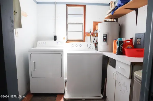 a utility room with dryer and washer