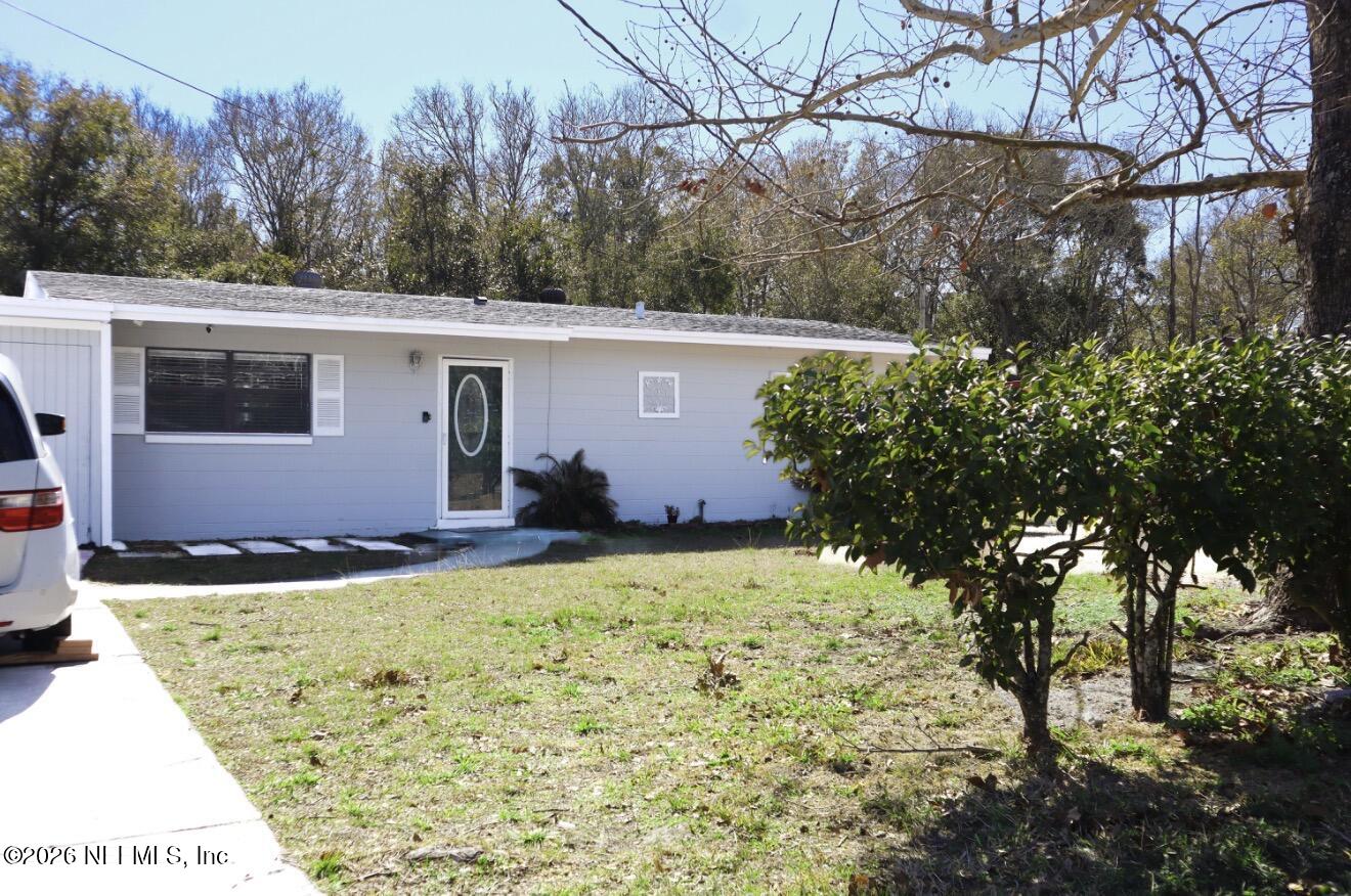 10162 Herndon Road Jacksonville, FL 32246 - Photo 2 of 31 a view of a house with a yard