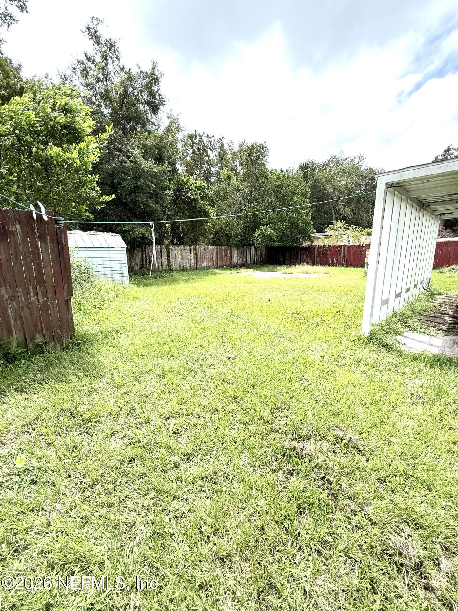 10162 Herndon Road Jacksonville, FL 32246 - Photo 26 of 31 a view of a garden and basketball court